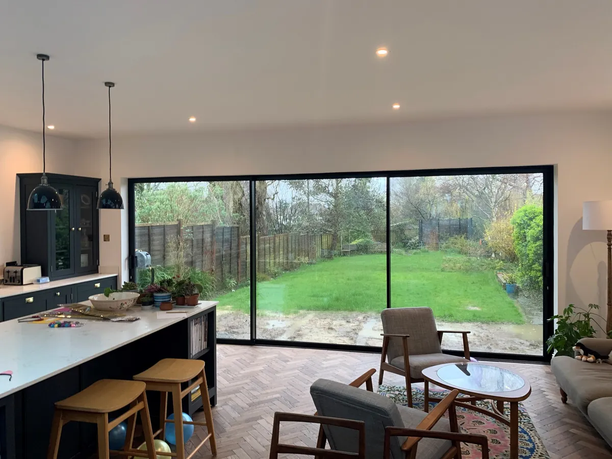 Slim black sliding doors onto the garden, Shirley