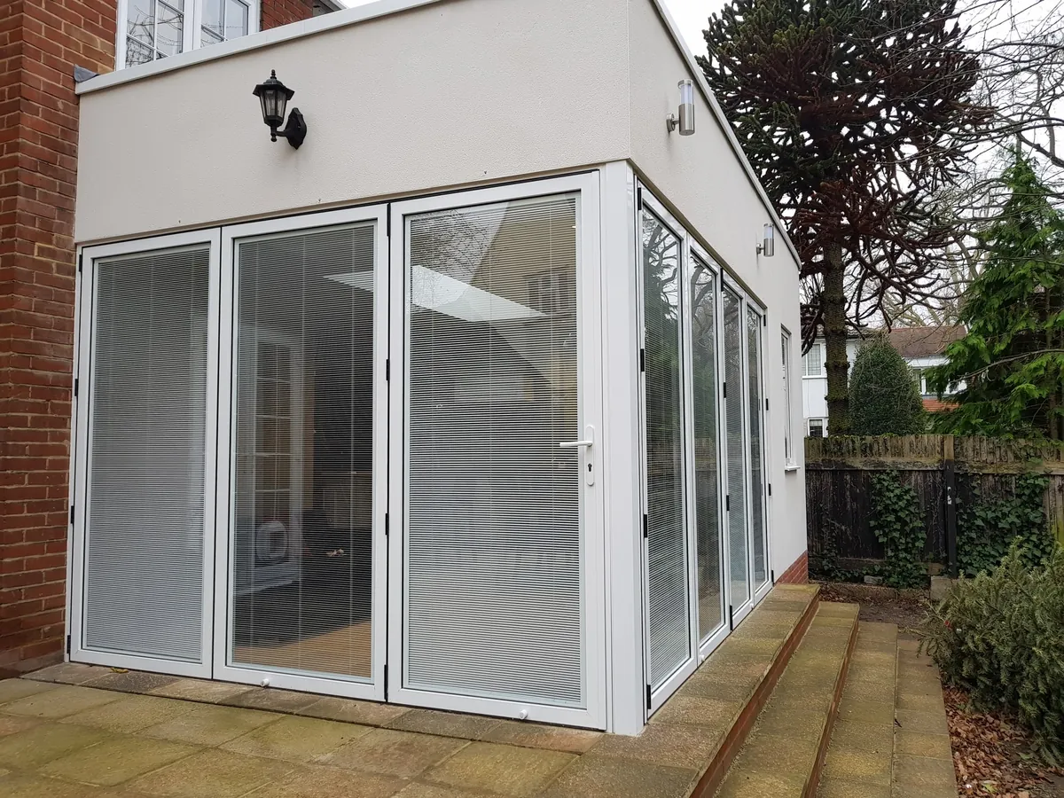 White UniFOLD HI bifolds with integral blinds